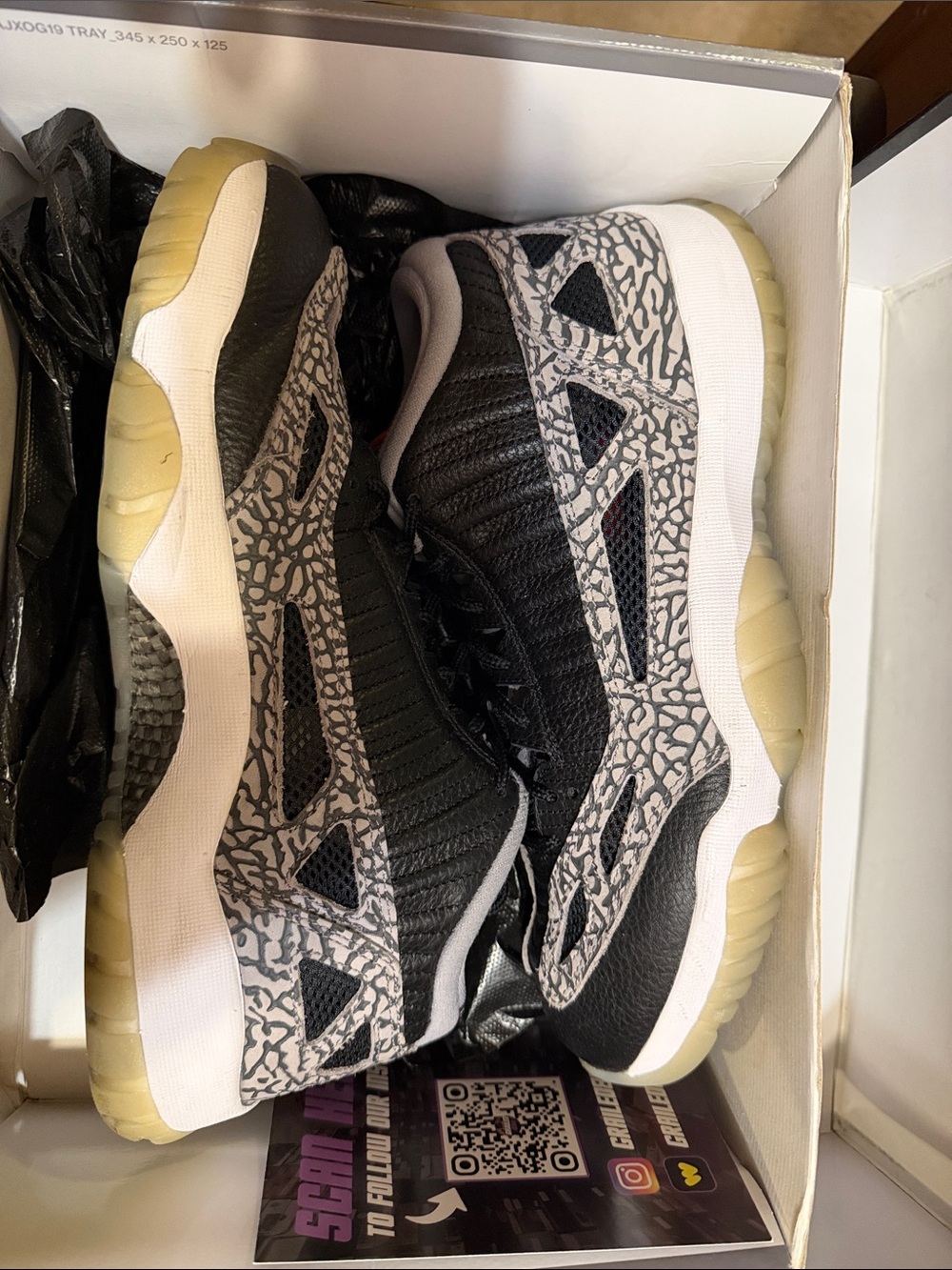 Jordan 11 IE Black Cement